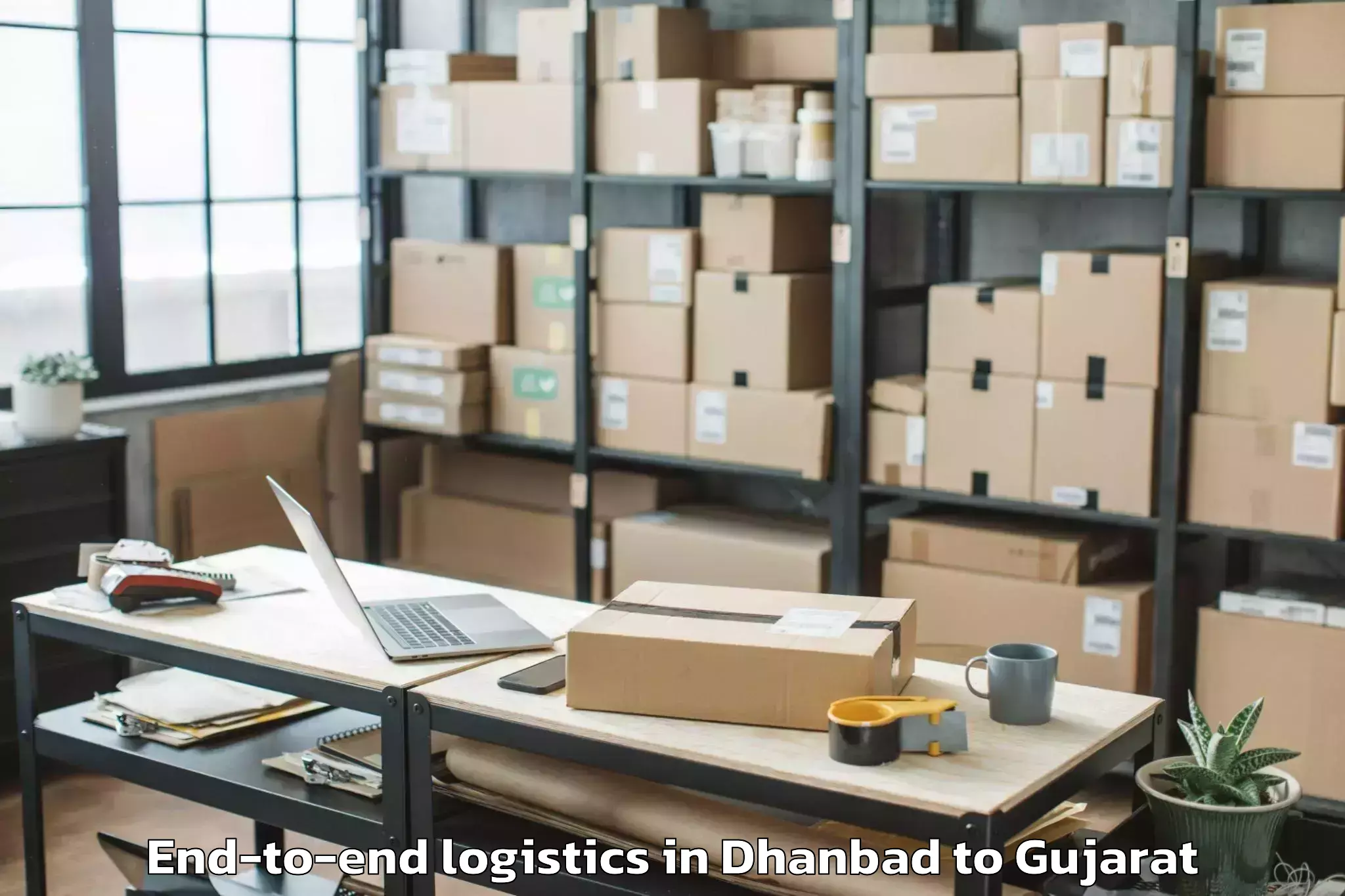 Reliable Dhanbad to Waghai End To End Logistics